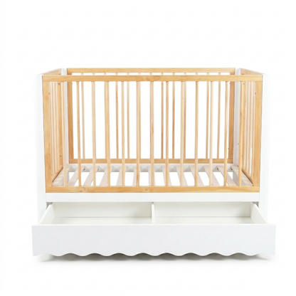 Baby crib with storage compartments on white background