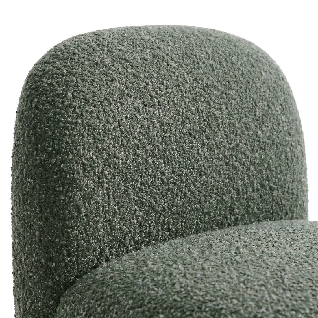 Close-up of green chair backrest and seat upholstery