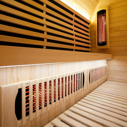 Interior corner of a wooden sauna with infrared heaters and benches
