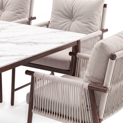 Partial view of a dining chair and table corner on a white background
