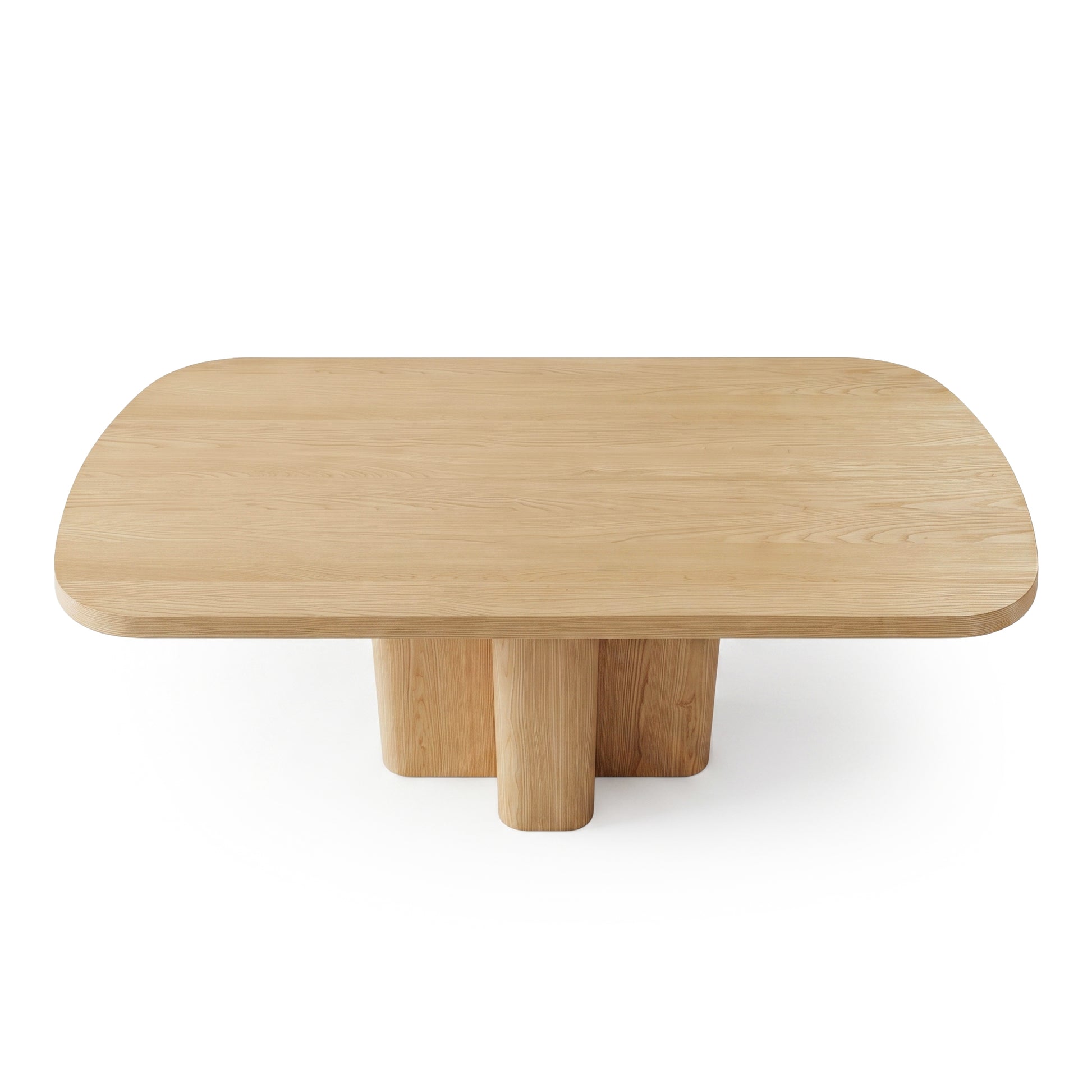 Rectangular wooden coffee table with rounded edges and four cylindrical legs on white background