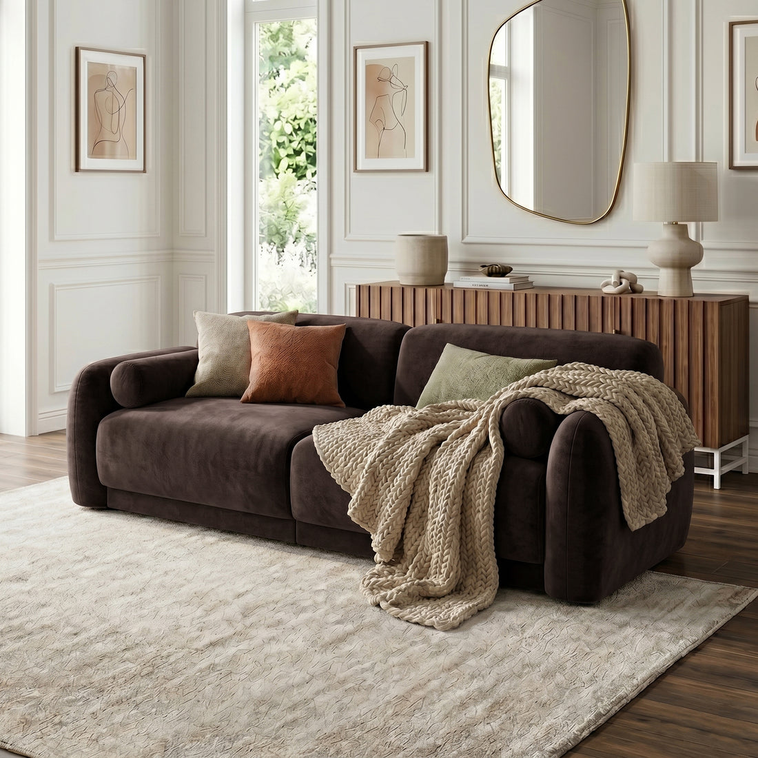 Dark brown sofa styled with pillows and throw in modern living room setting