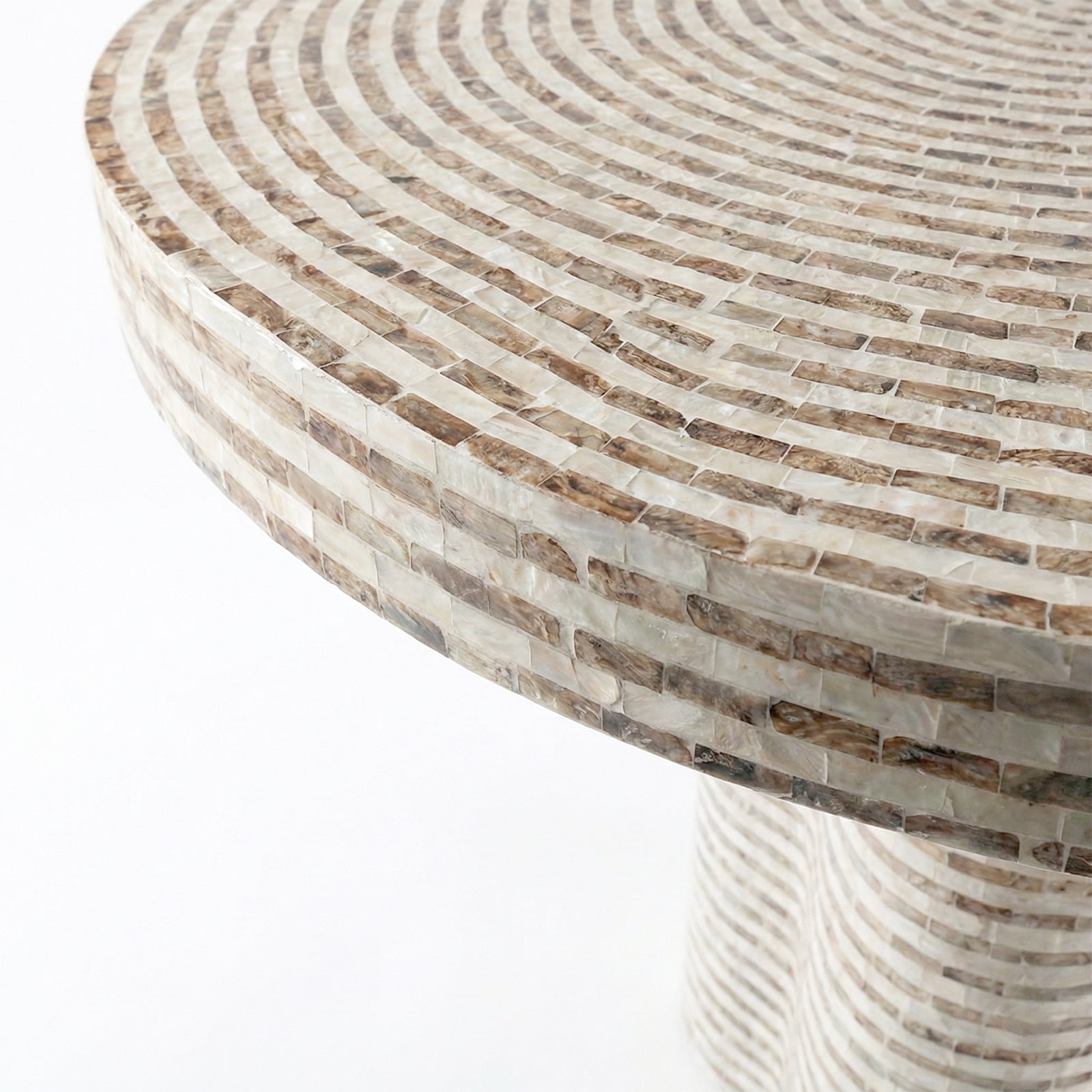 Close-up of mosaic table surface and edge on white background