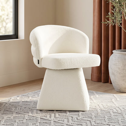 Off-white modern accent chair in a bright room setting with rug and window.