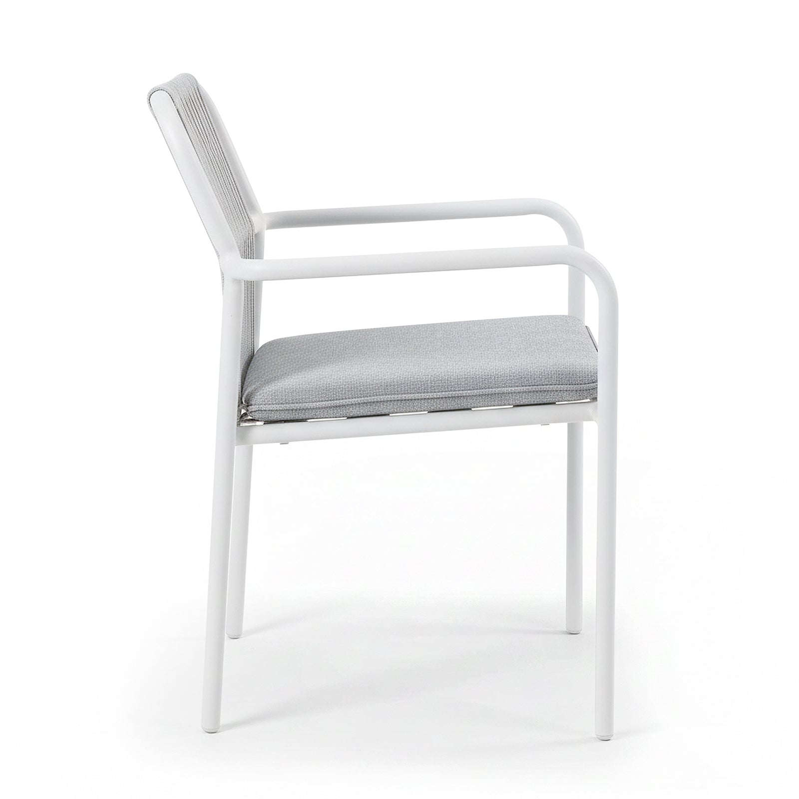Evone 4 Seater Stone Outdoor Dining Table Set in Light Grey features a sleek stone tabletop and sturdy white metal frame, complemented by light gray upholstered chairs, perfect for stylish outdoor dining.
