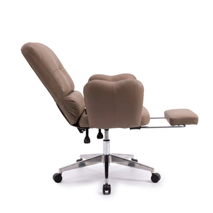 Rear side view of a tan recliner office chair with extended footrest and chrome wheeled base on a white background