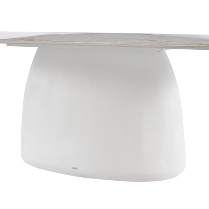 Close-up of the base and edge of a modern white table on a white background