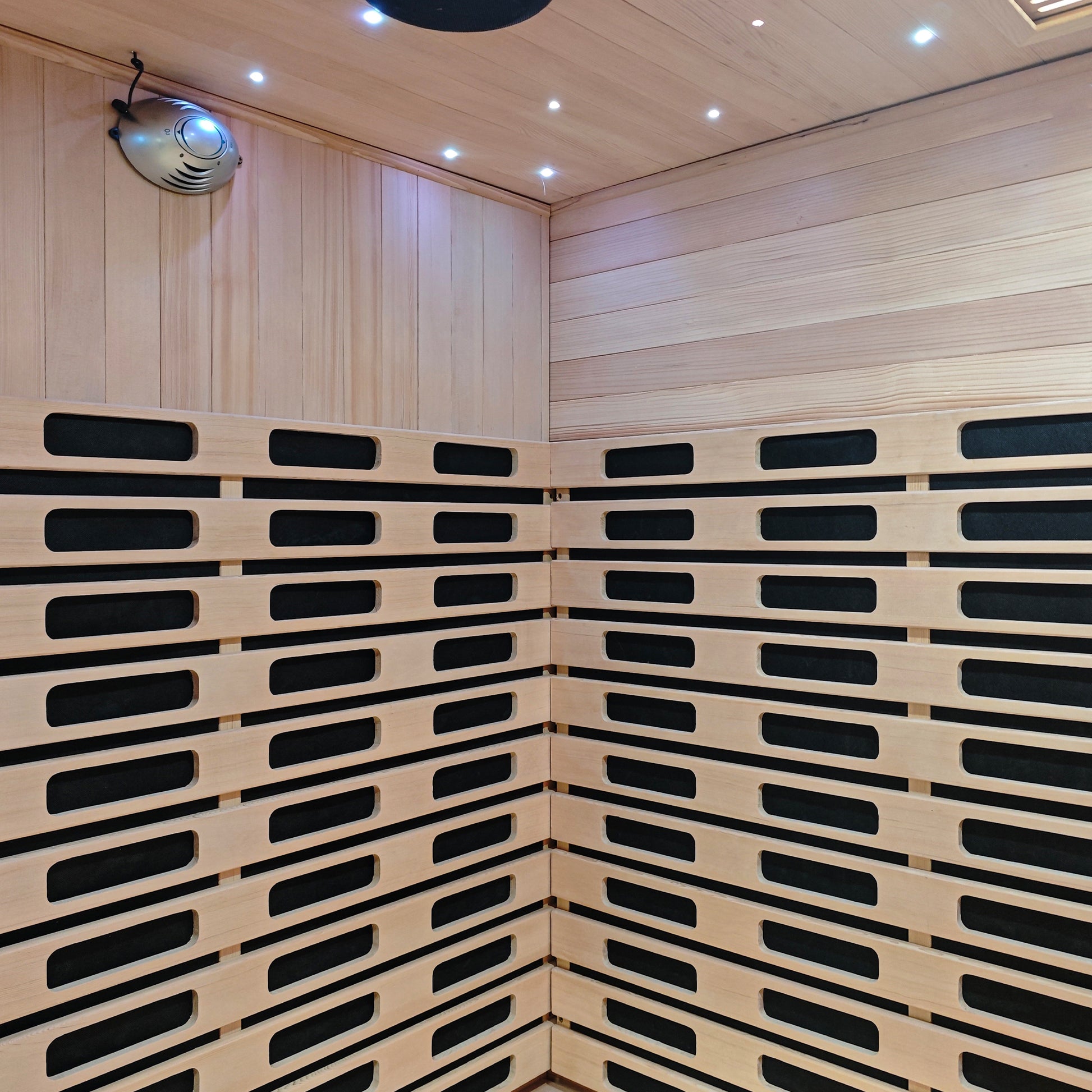 Wood-paneled sauna interior with built-in heating elements