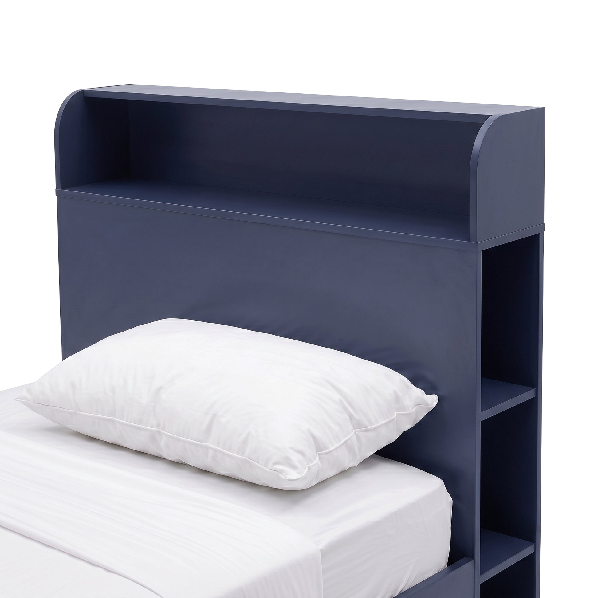 Partial view of a blue bed headboard with built-in shelving on a white background