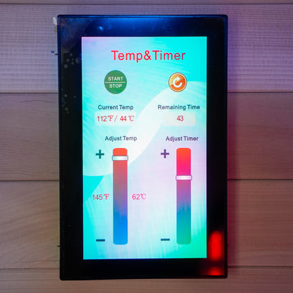 Digital sauna control panel mounted on a wood-paneled wall