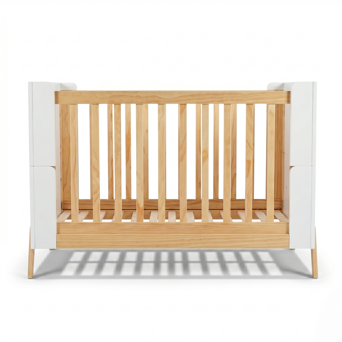 Modern wooden crib with white panels on white background