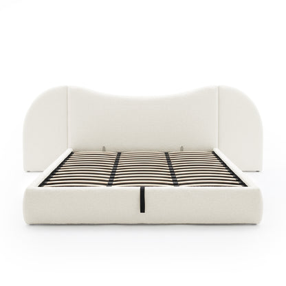 Unmattressed bed frame with slats and curved headboard on white background