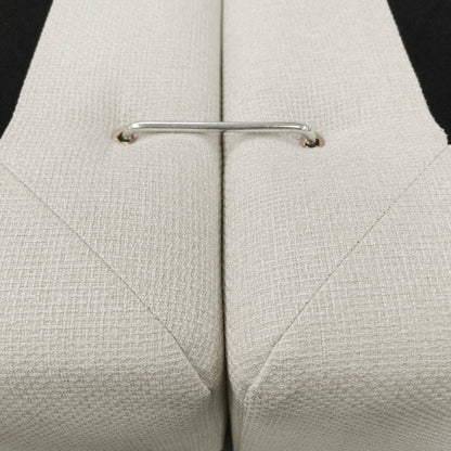 Close-up of stitched upholstered sections with a metal connector