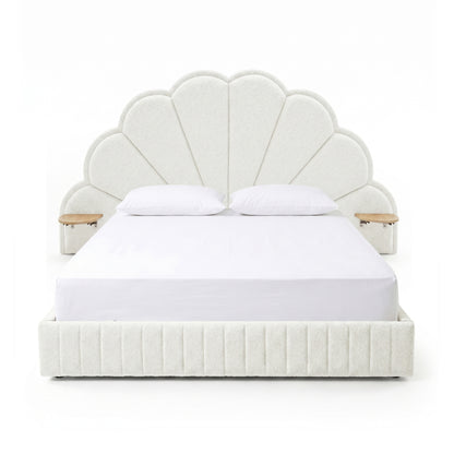 Full view of upholstered scallop headboard bed with built-in side tables on white background