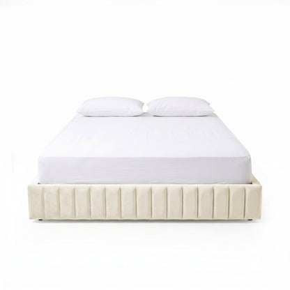 Front view of modern upholstered bed with white bedding and pillows on white background