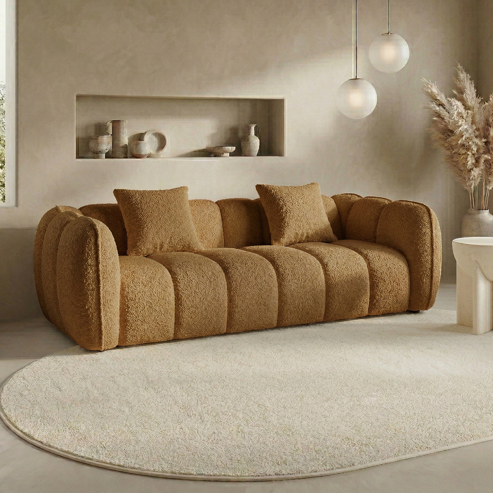 Brown sofa in a neutral-toned living room with rug and decor