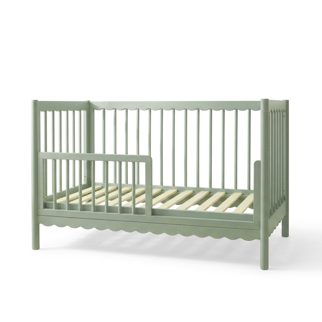 Sage green convertible crib on white background