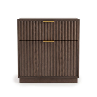 Full view of a modern walnut cabinet with grooved front and gold handles on a white background