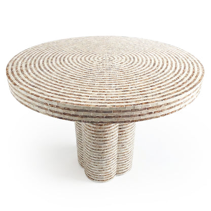 Round spiral mosaic table with three cylindrical legs on white background