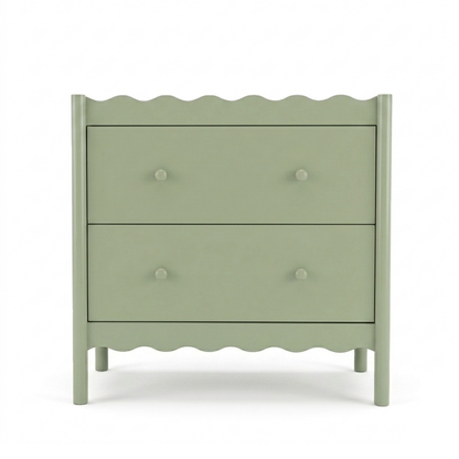 Sage green two-drawer dresser with wavy edges on a white background