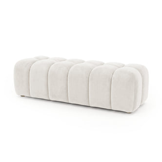 Cream upholstered segmented ottoman bench on a white background