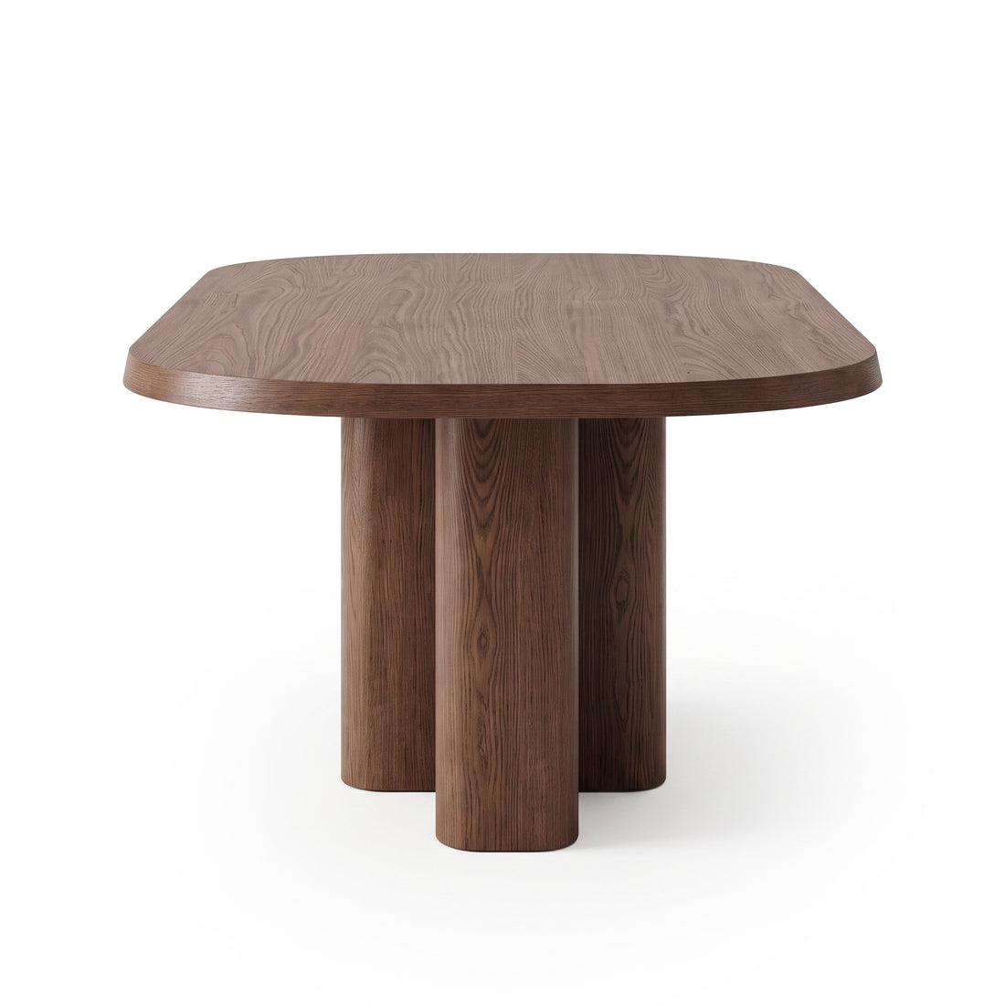 Modern rectangular wooden table with rounded edges and cylindrical legs on white background.