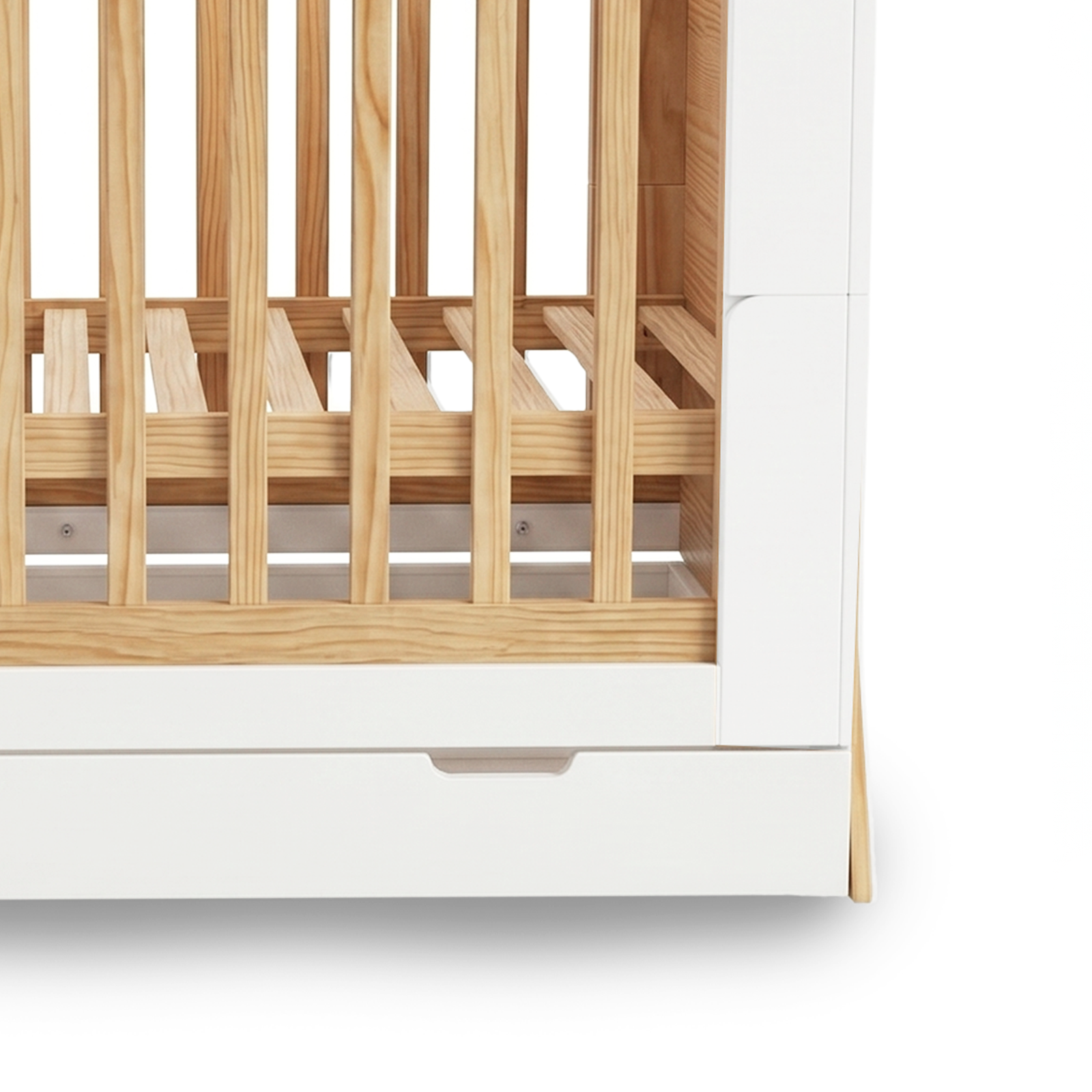 Close-up of crib lower half showing slats and drawer