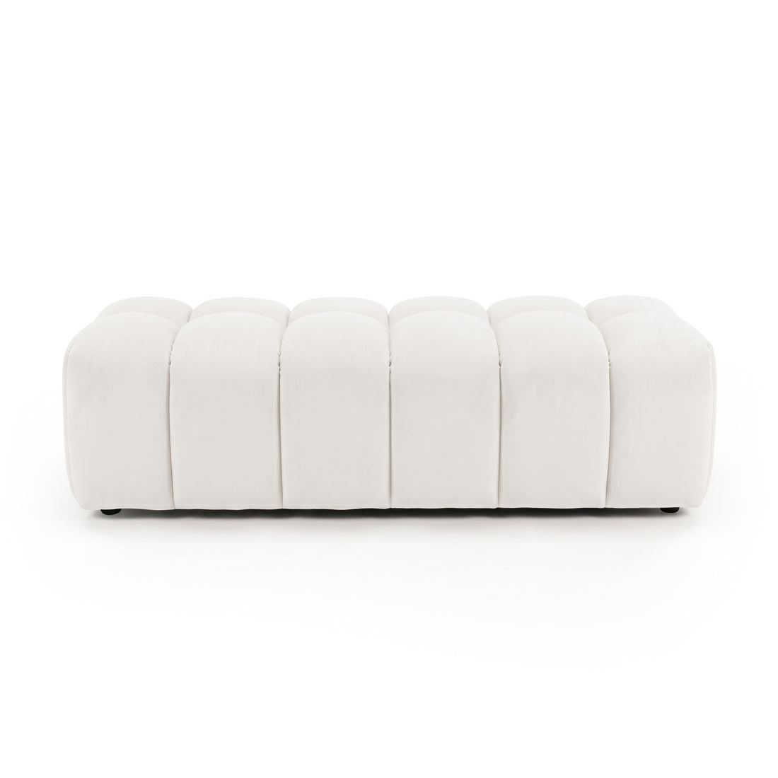 Light beige upholstered panel-tufted ottoman bench on a white background