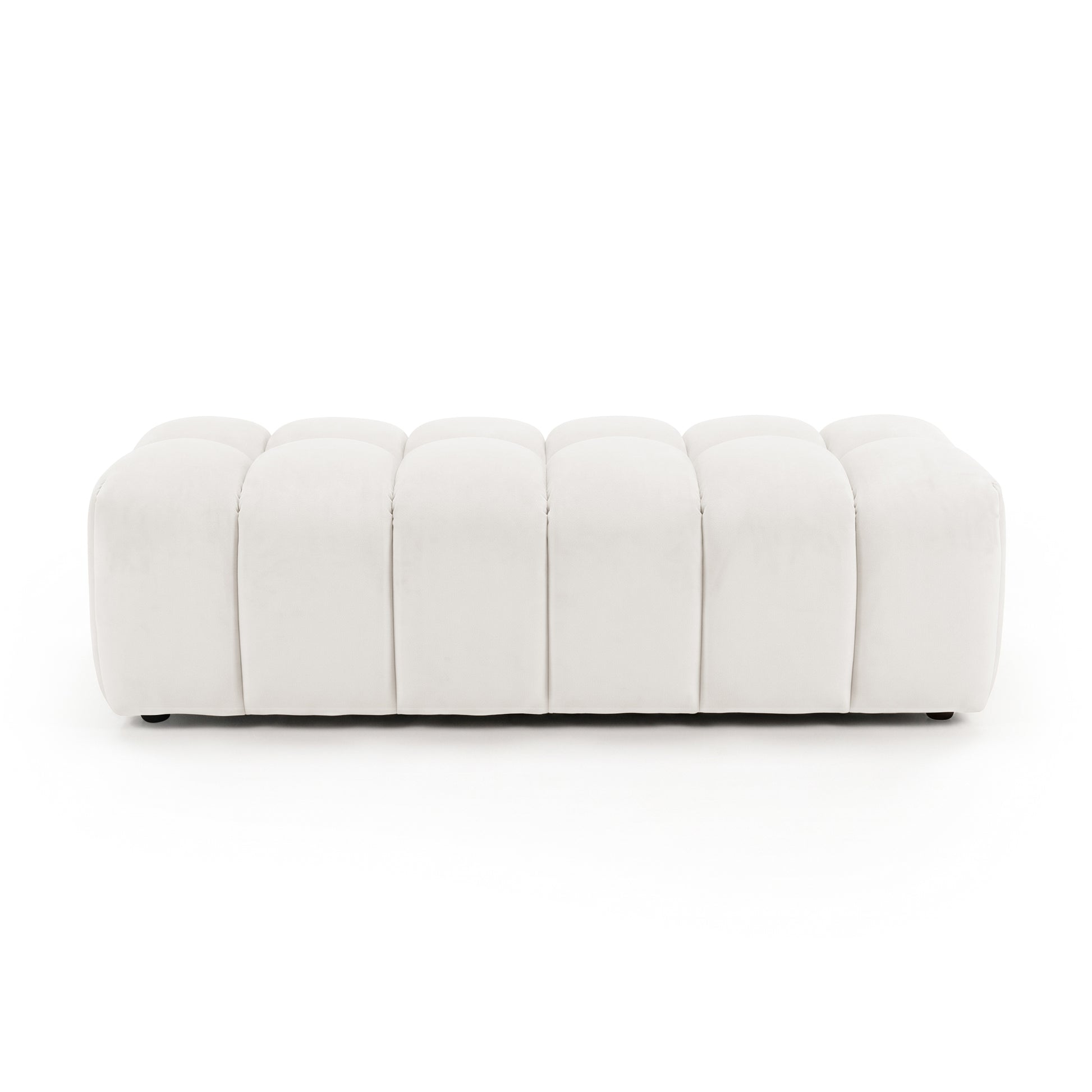 Light beige upholstered panel-tufted ottoman bench on a white background