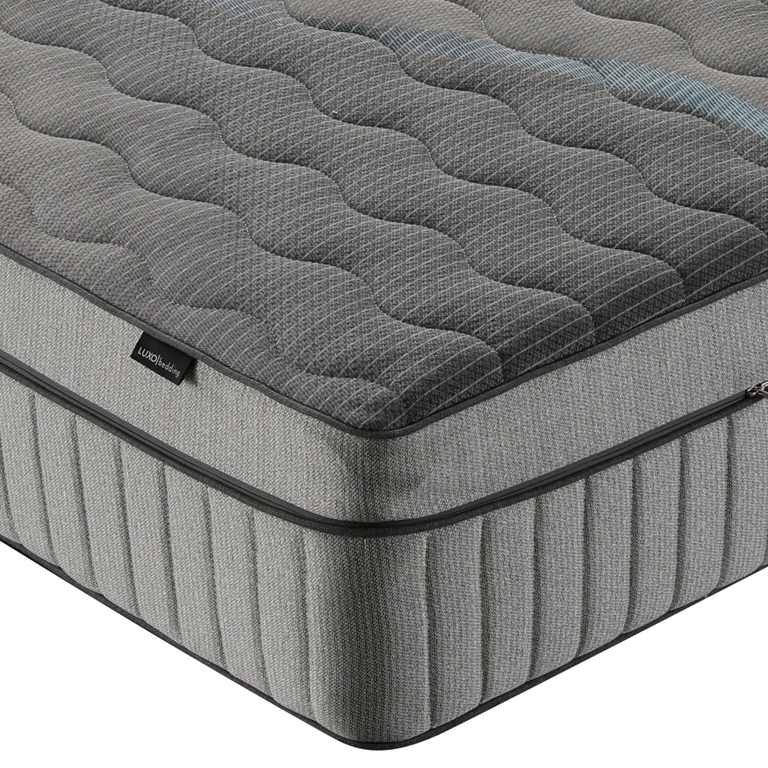 Close-up of mattress corner on white background