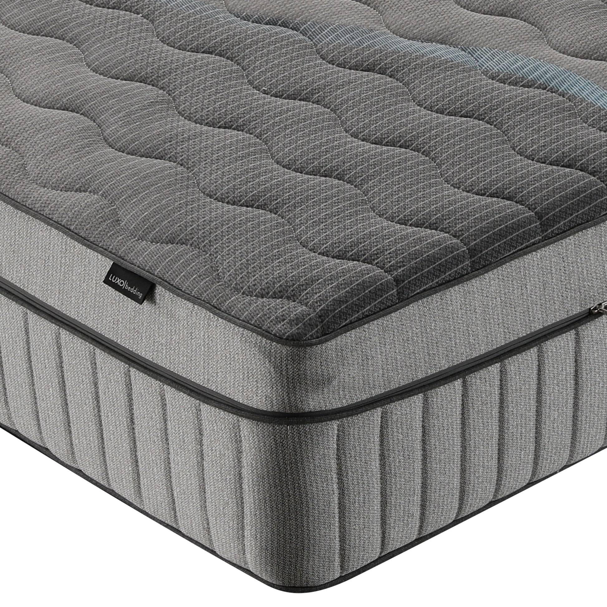 Close-up of mattress corner on white background