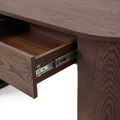 Close-up of an open drawer on a dark wood desk showing the drawer interior and slide hardware