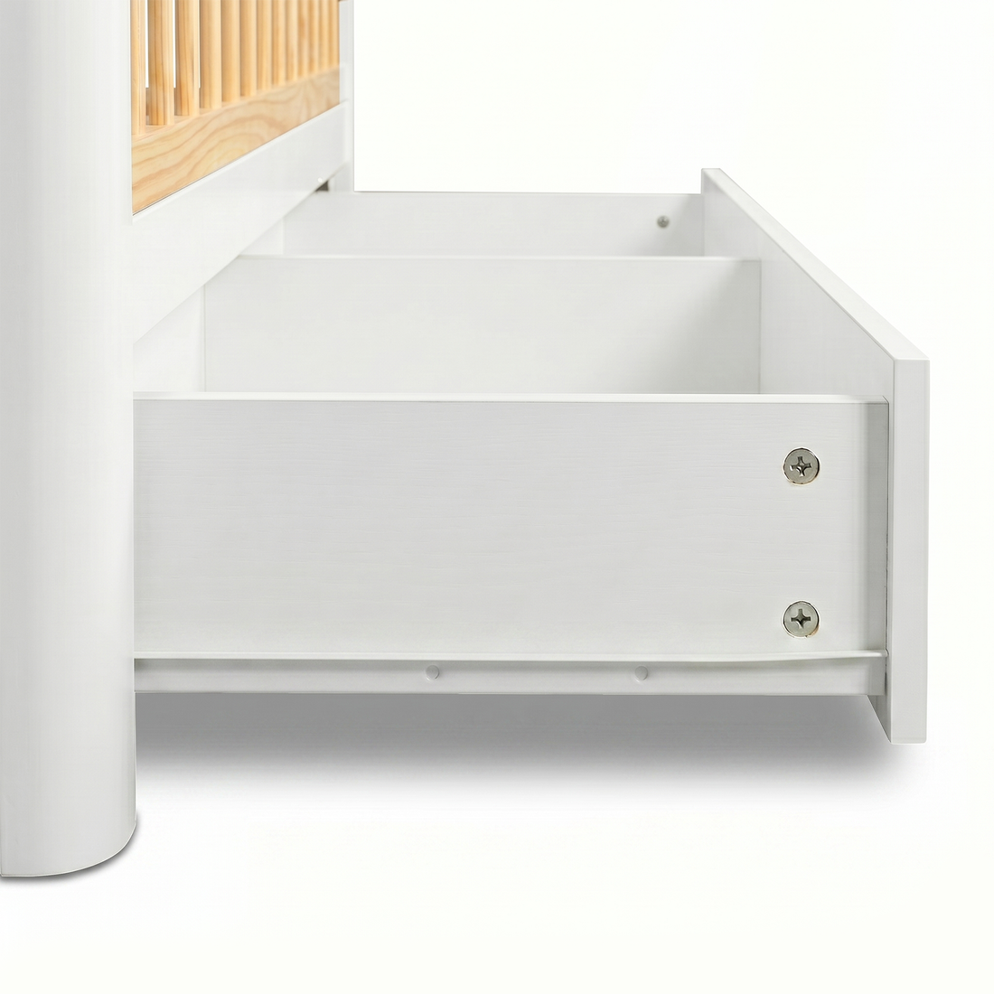 Close-up of crib drawer pulled out on white background
