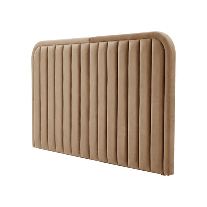 Angled view of tan upholstered headboard on white background
