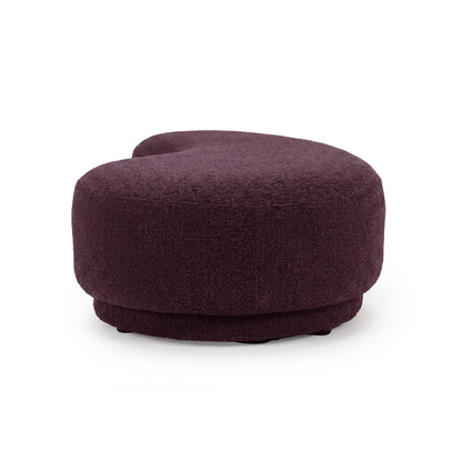 Plush modern bench seat with kidney-shaped design on a white background