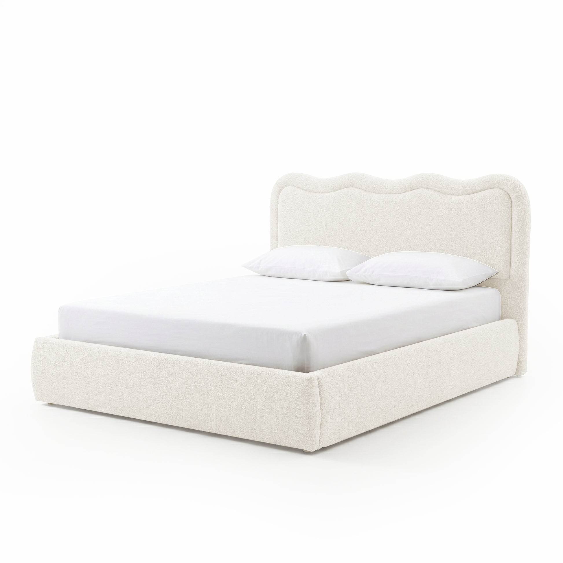 Modern upholstered bed with pillows on white background