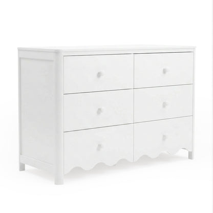 Angled view of white dresser on white background showing front and side