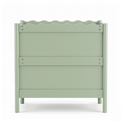 Pastel green child's bed or cot on a white background