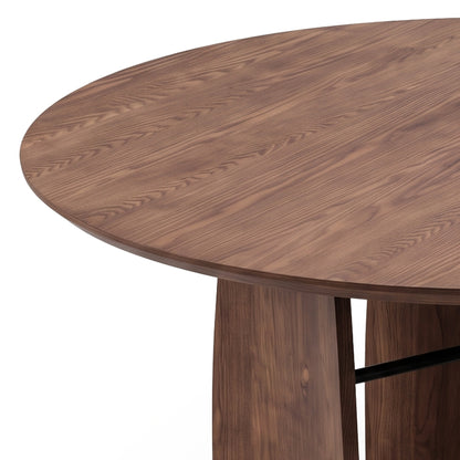 Partial view of a round wooden table on a white background