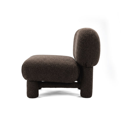 Side profile of dark brown boucle accent chair on white background