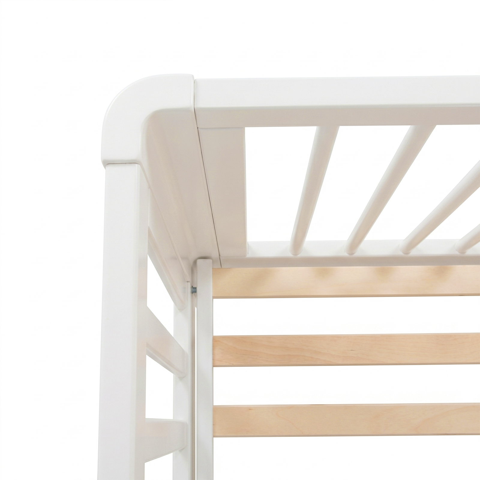 Close-up of crib corner showing rounded edge and slats
