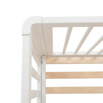 Close-up of crib corner showing rounded edge and slats
