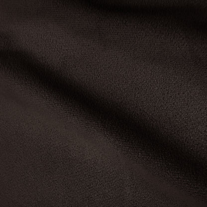 Close-up of dark brown soft textured fabric with folds