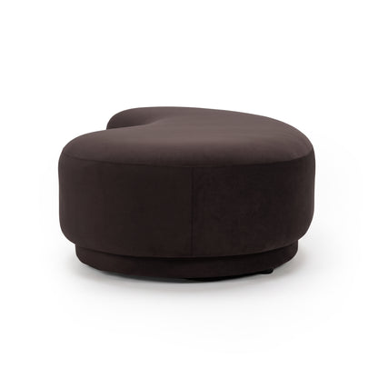 Plum modern curved bench seat photographed on a white background at an angle