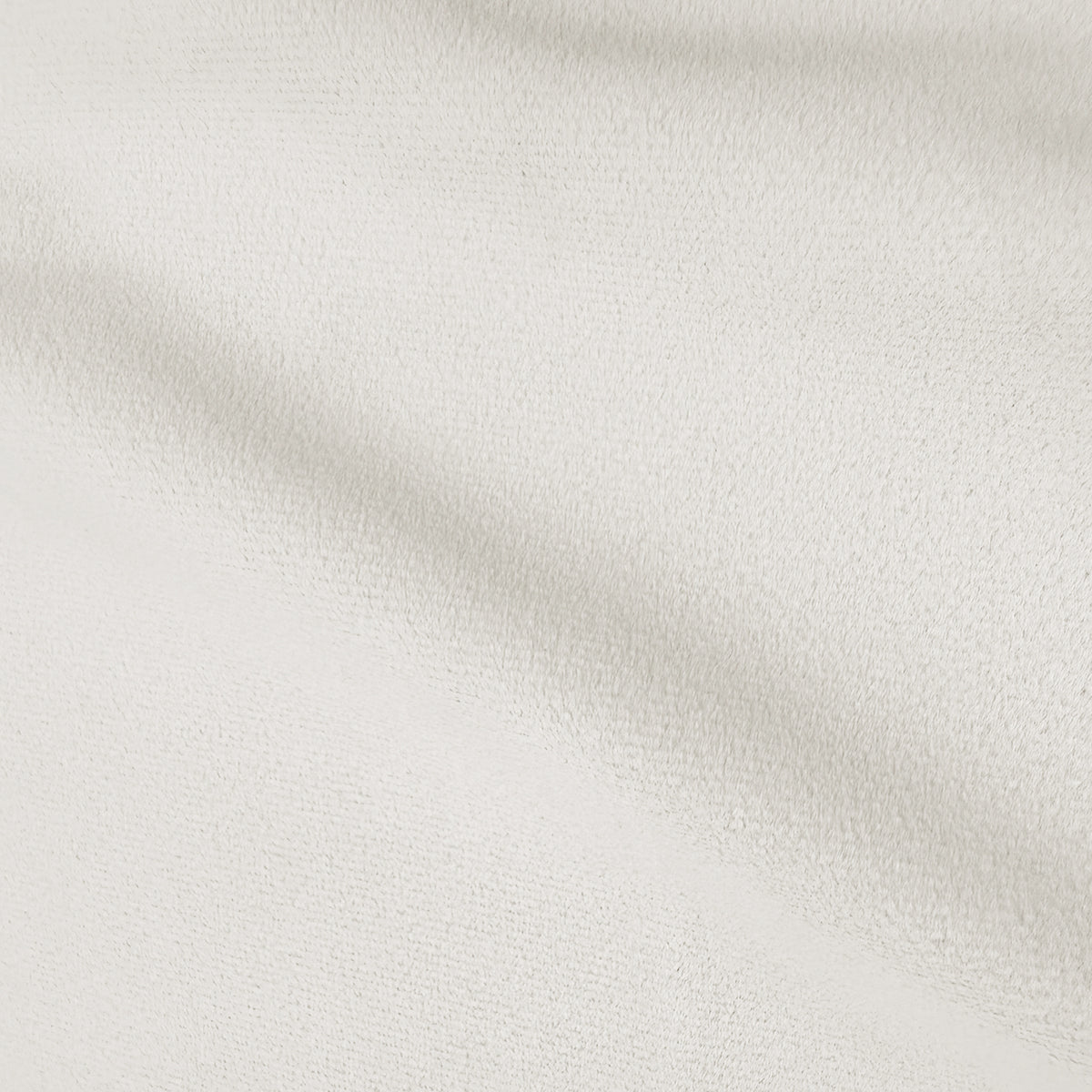 Extreme close-up of soft ivory upholstered bed fabric texture