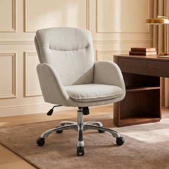 Beige upholstered office chair in a furnished room beside a wooden desk