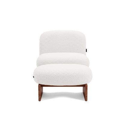 Modern accent chair on white background, front view.