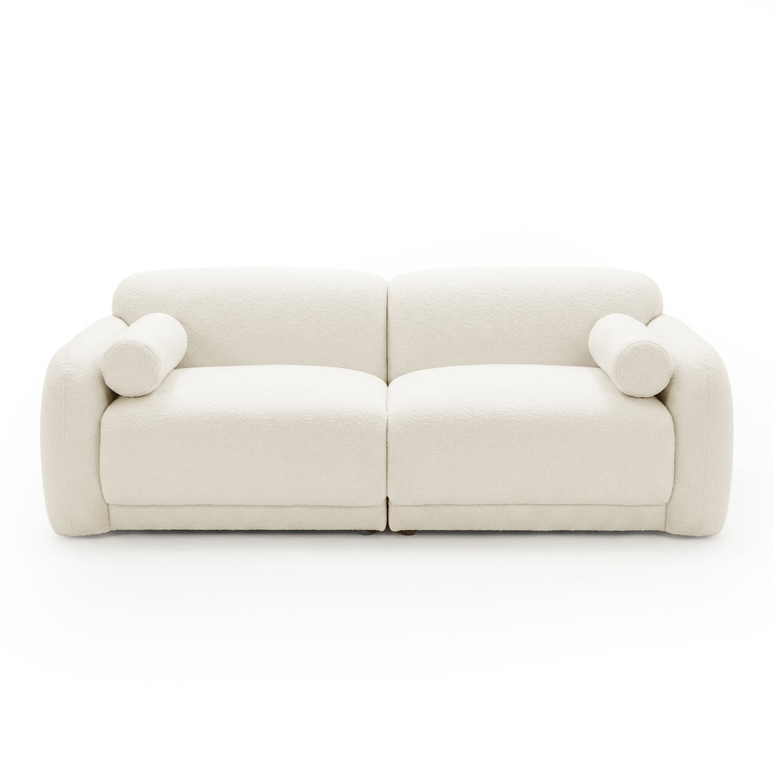 Off-white sofa with rounded arms and cylindrical cushions on white background