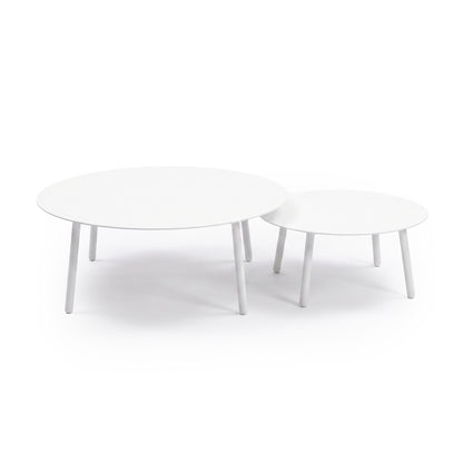 Two round white nesting tables on a white background
