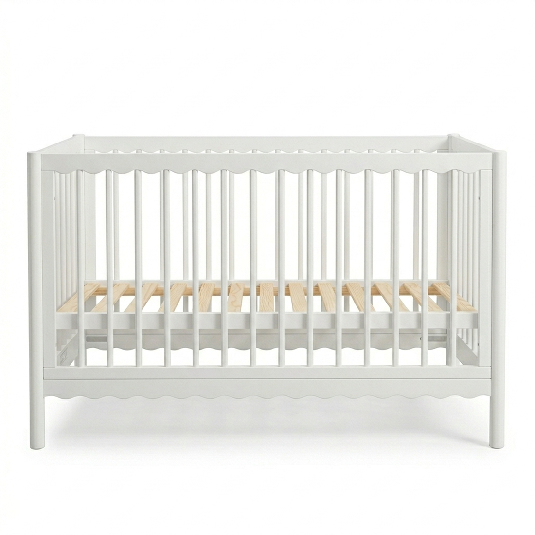 White crib with natural wood slats on a white background